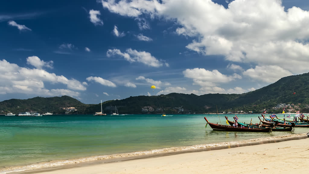 A beach on Phuket's Andaman coast with clear turquoise water